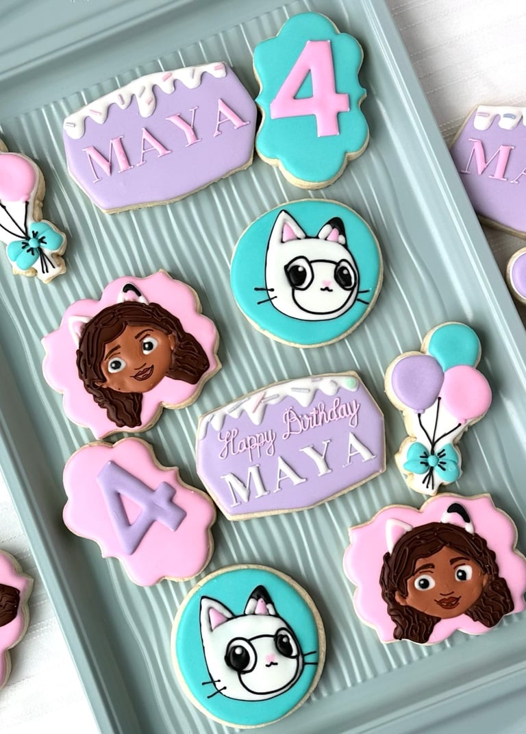 a tray of decorated birthday cookies