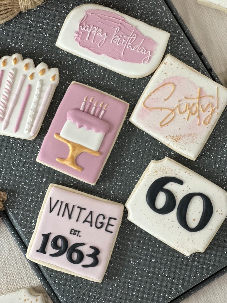 a number of cookies decorated with birthday candles
