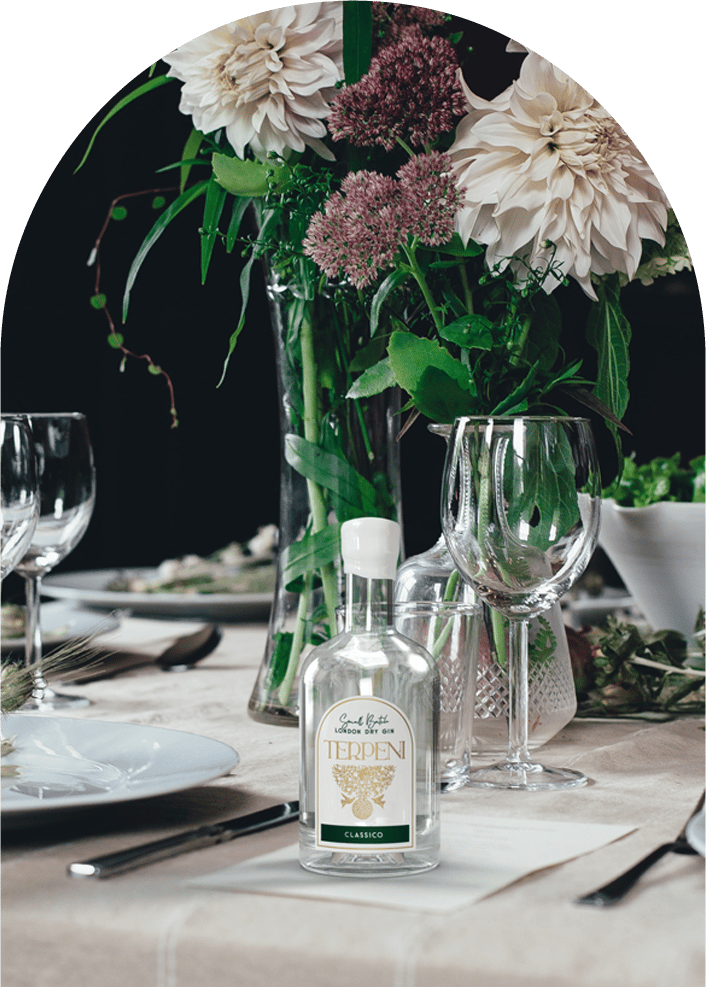 a table setting with a vase of flowers