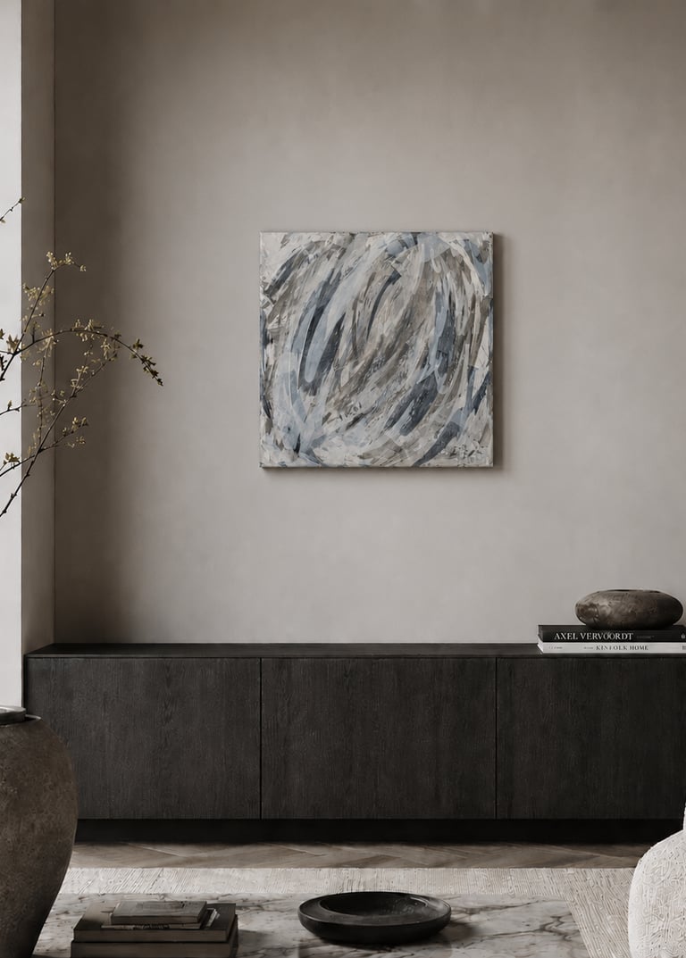 Modern minimalist living room featuring abstract wall art above a dark wood sideboard cabinet.