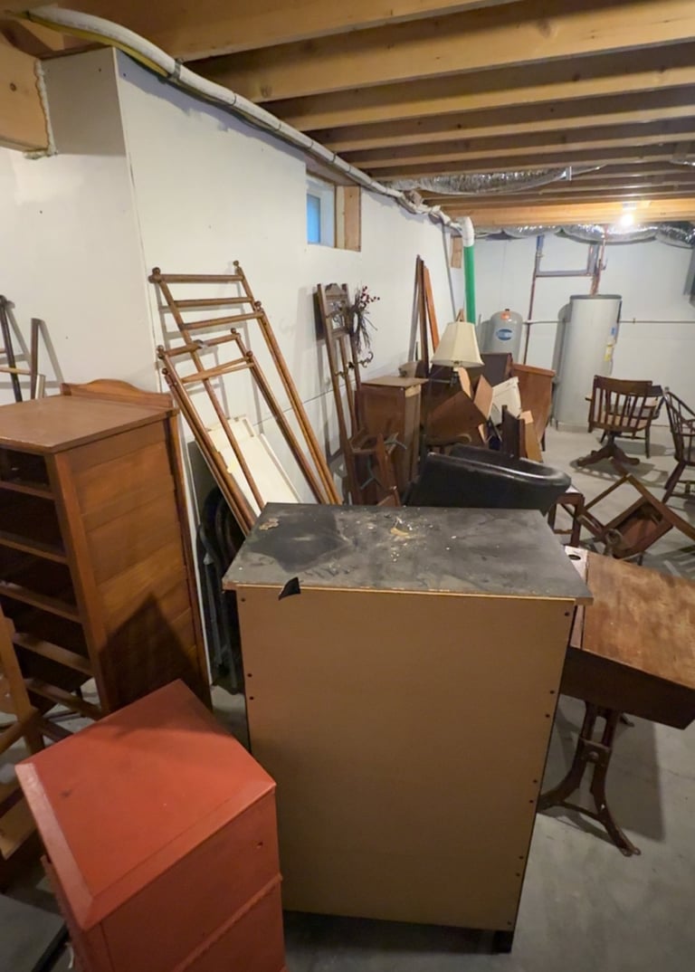 Basement filled with debris before cleanout and junk removal