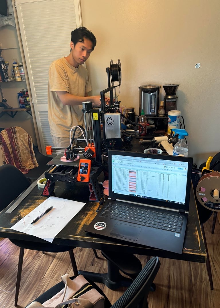 a man standing in front of a laptop computer