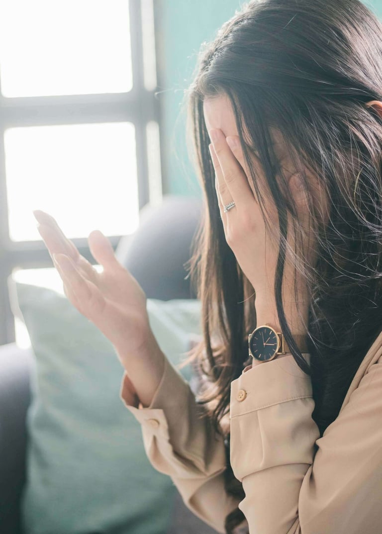 a woman raising her hand in desperation