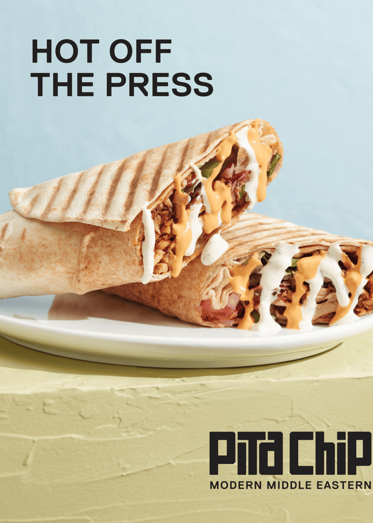 A promotional poster depicting a shawarma wrap and text that says "Hot Off the Press"