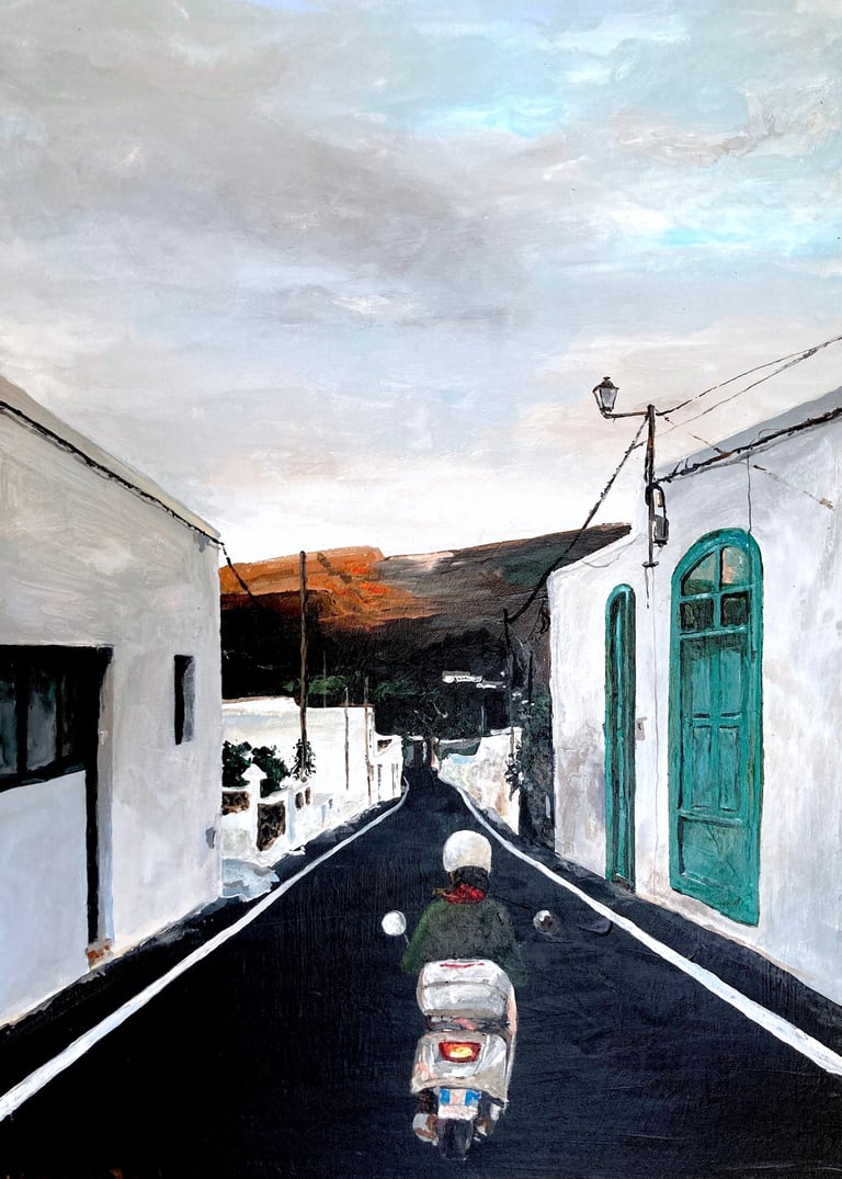 a woman riding scooter in Spanish village