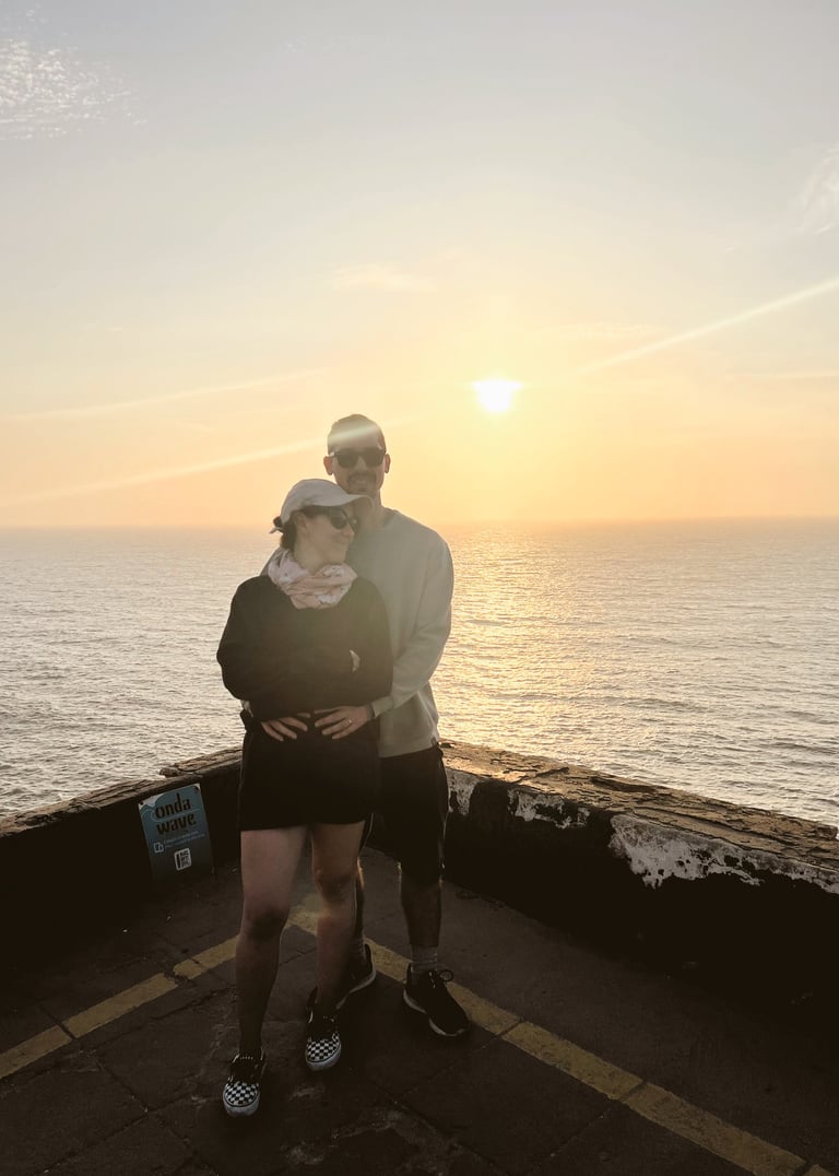 a man and woman standing on a pier