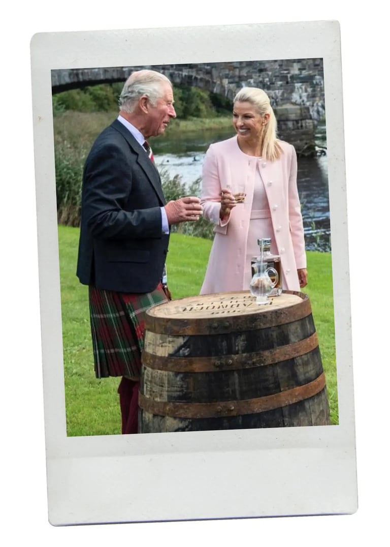 dhm.style styling concierge photo with King Charles and guests at a riverside event.