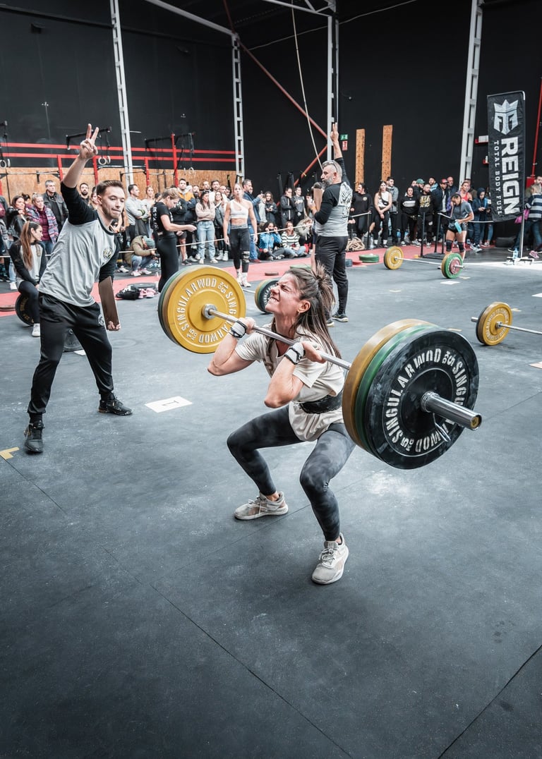a woman is doing a squat - lift in a gym