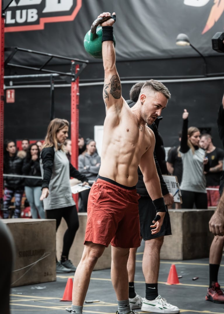 a man holding a kettlebell in a gym