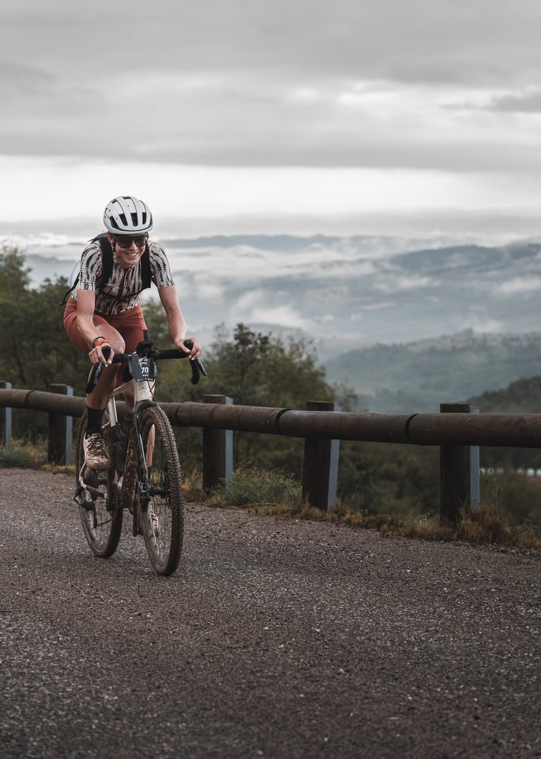 a woman riding a bike on a road