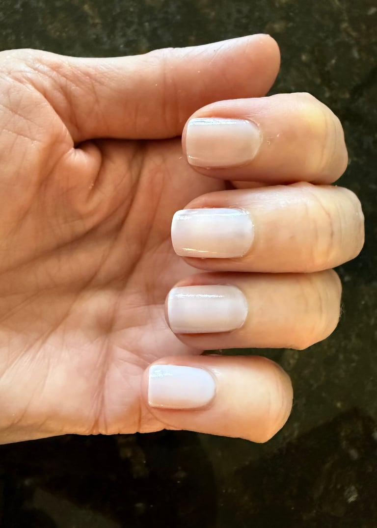 Two coats of sheer nail polish giving a clean, natural, healthy looking finish on the nails.