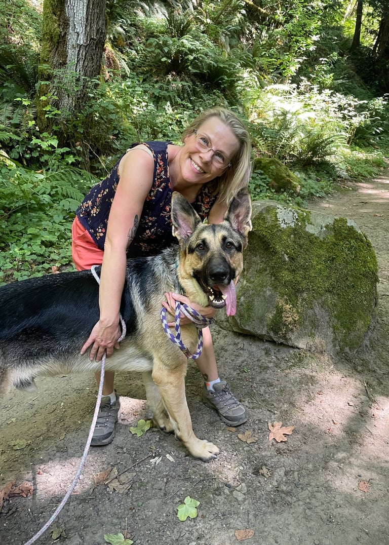 Tailored Courage's behavior consultant hiking with her dog