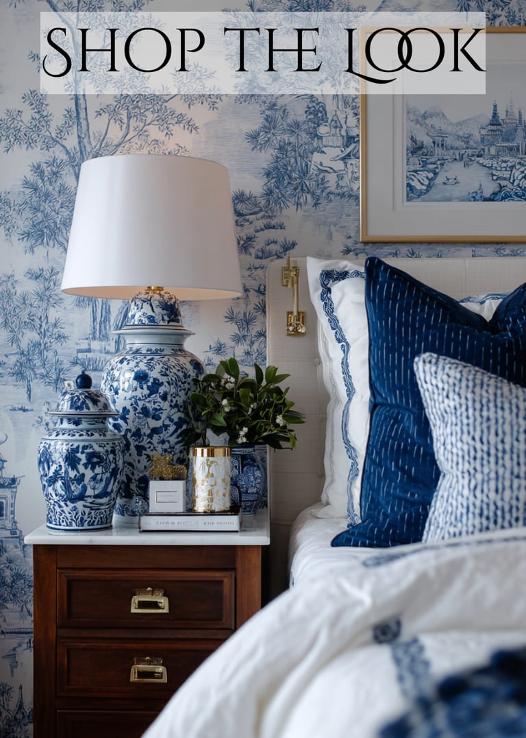 a bedroom with a lamp and a lamp on a nightstand