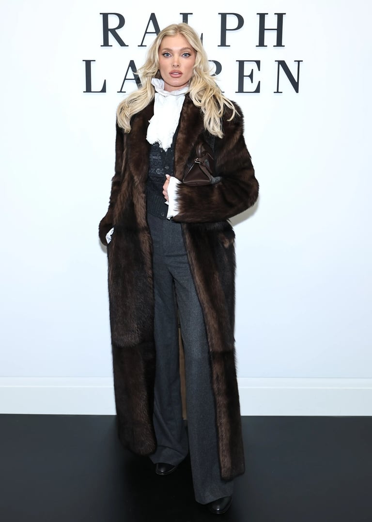 Elsa Hosk wearing a dark fur coat and tailored trousers at the Ralph Lauren New York Fashion Week 2025 show