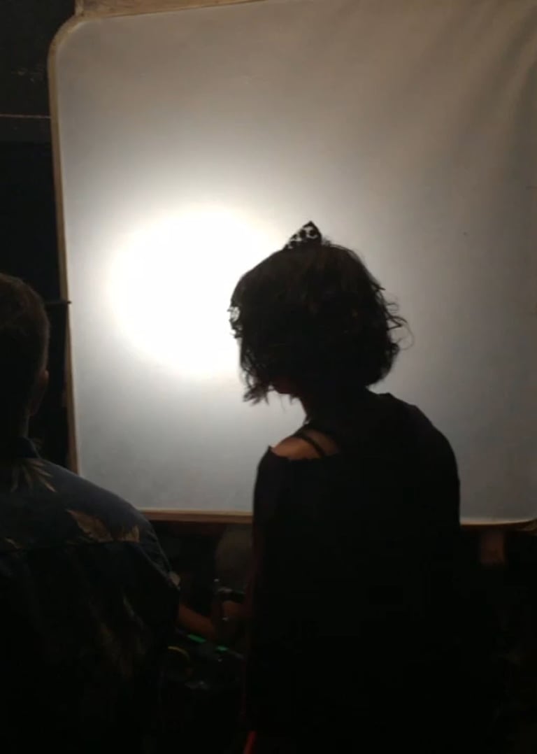 Actress Starlise Waschuk silhouetted on the set of Fatal Rhapsody