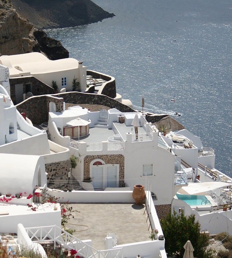 a house with a pool and a view of the ocean