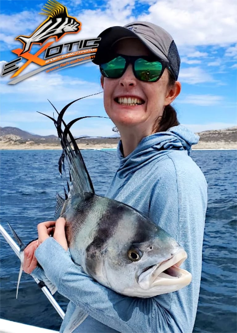 a woman holding a fish on a boat