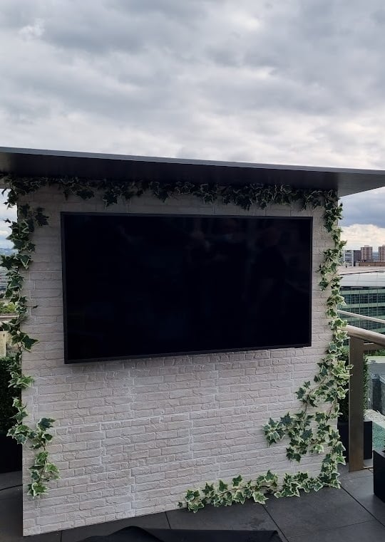 Professional installation of a Samsung Terrace outdoor TV on a luxury balcony overlooking the London