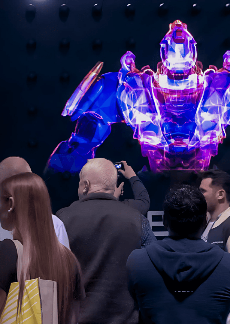 a man taking a picture of a giant robot