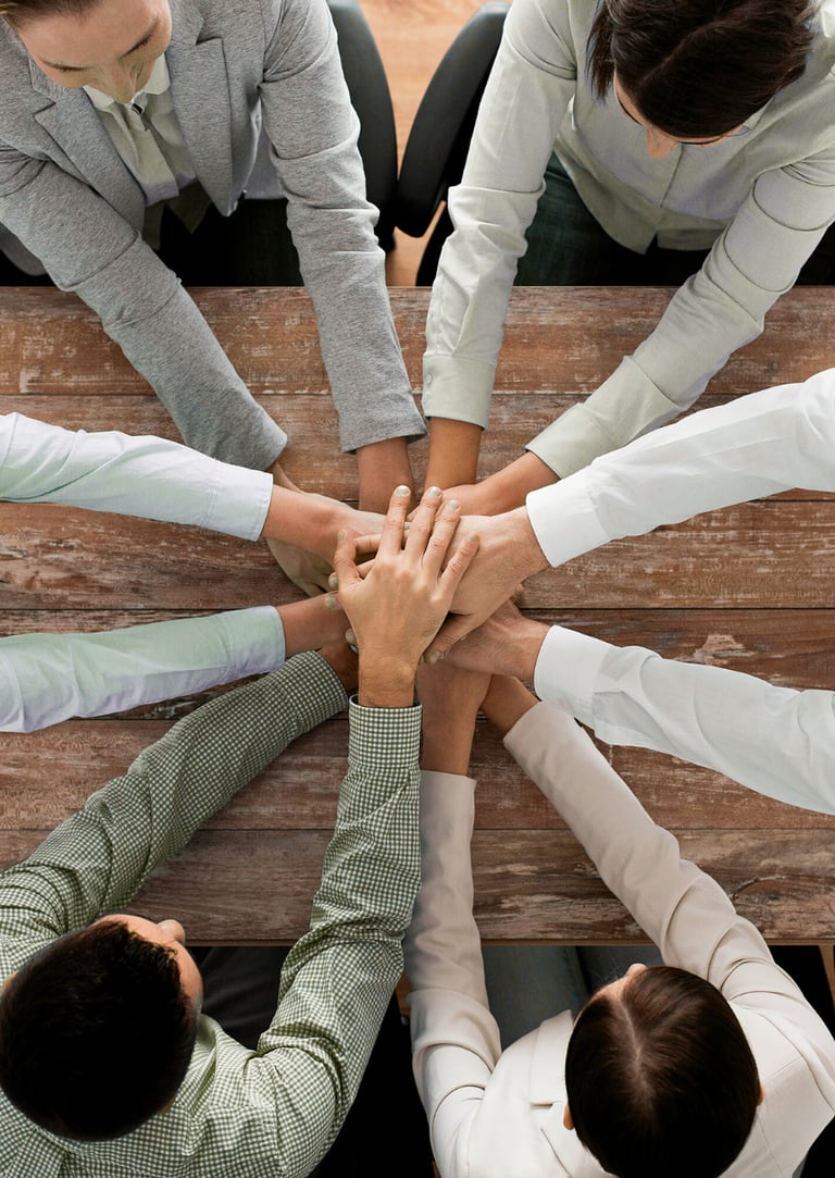a group of business people sitting around a table