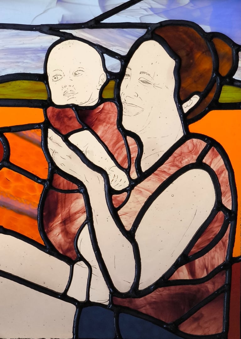 a painting of a woman holding a baby in a stained glass window