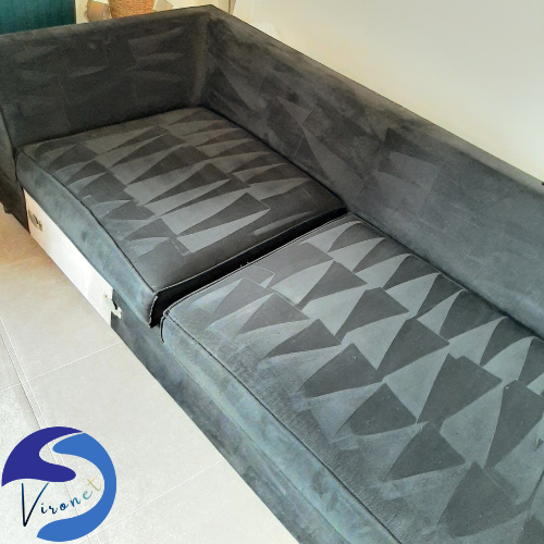 Canapé parfaitement nettoyé avec motifs triangulaires mis en valeur après un nettoyage textile pro