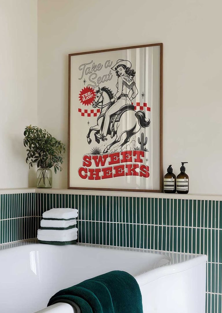 Vintage cowgirl bathroom wall art with western illustration and Sweet Cheeks typography