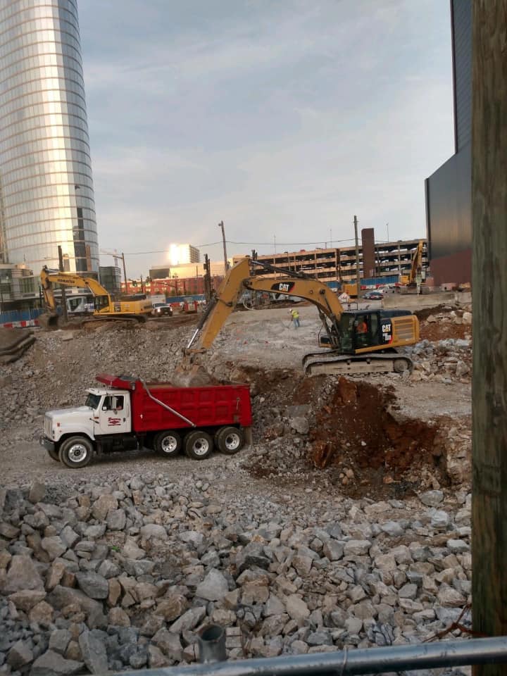 Dump truck and excavator, excavation, excavating, hauling