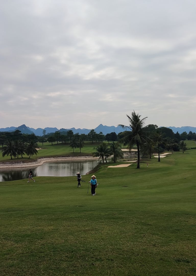 a man is playing golf on a golf course in Vietnam