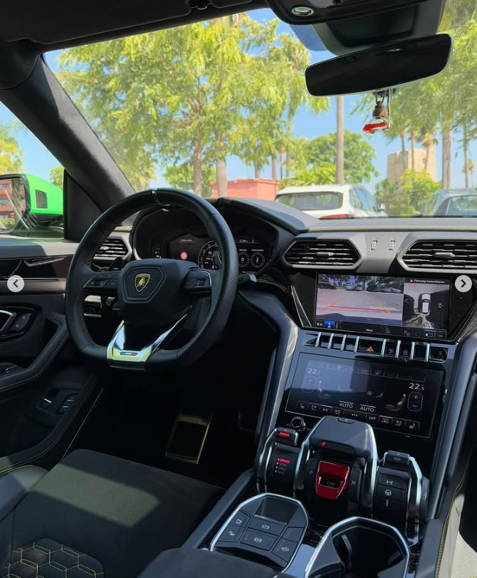 Interior luxury cockpit of a Lamborghini Urus SUV featuring a digital dashboard and infotainment system.