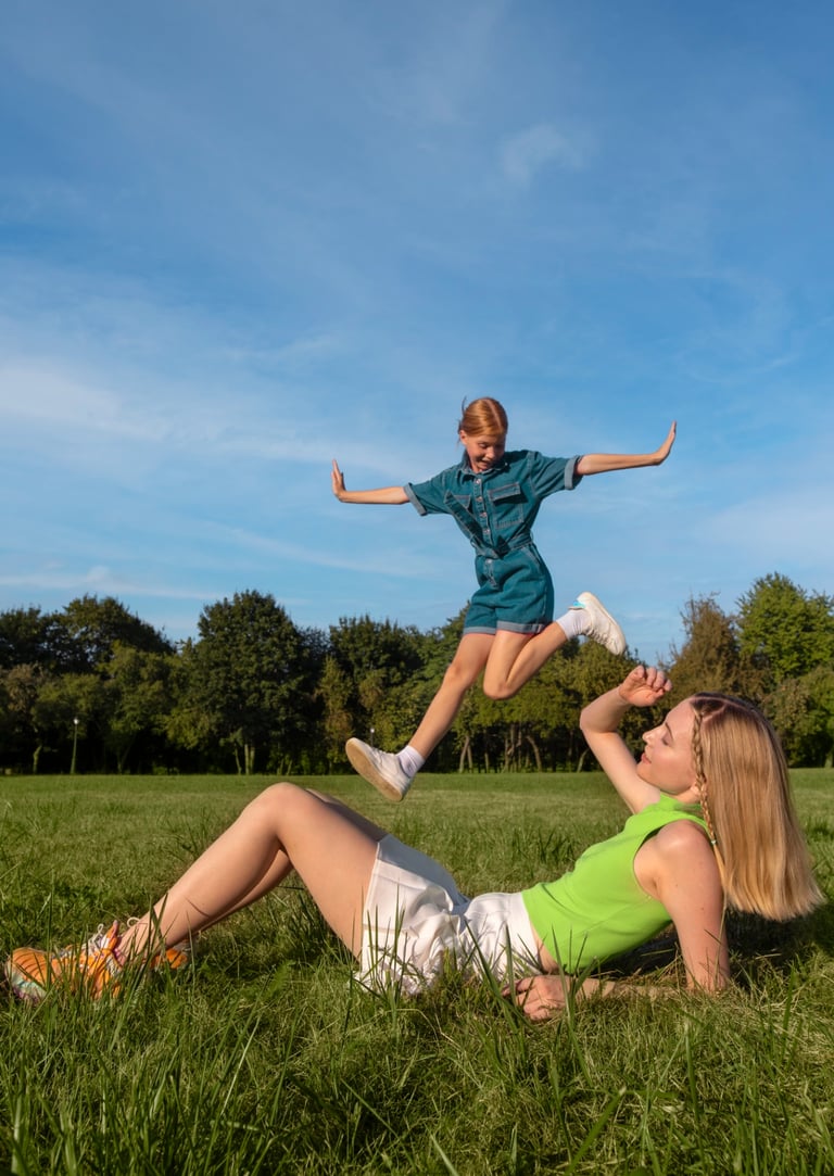 a woman and a child playing with a frisbee
