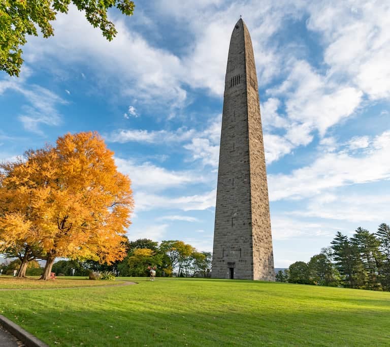 Bennington Battle Monument viewed across a green field