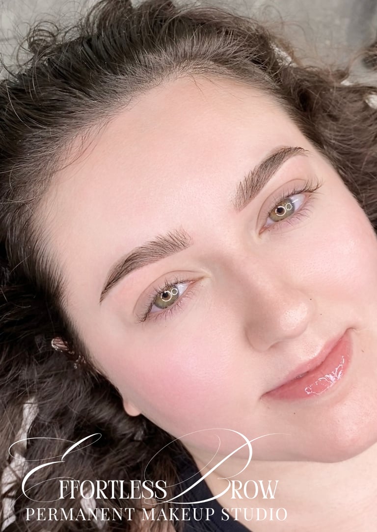A view of symmetrical and softly defined ombre powder brows immediately after the service.