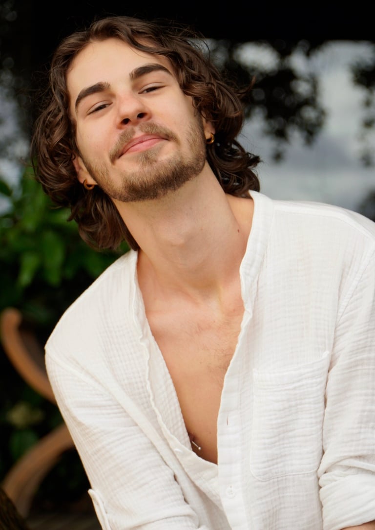 a man with a beard and a white shirt