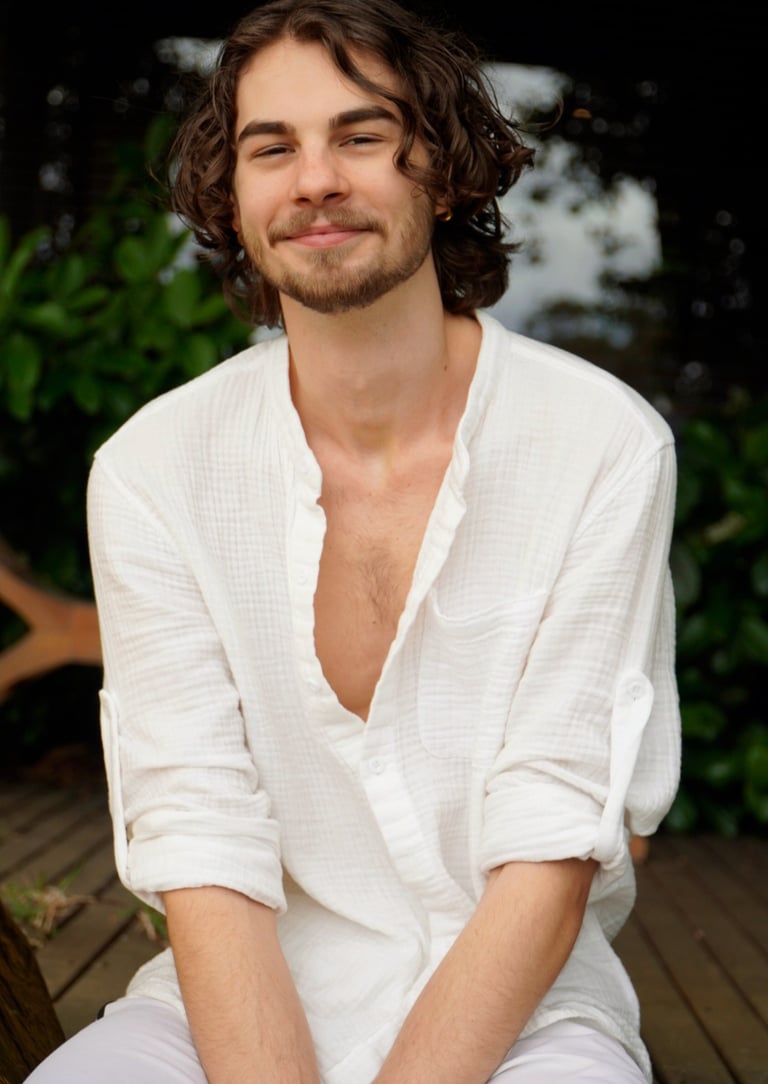 a man with a beard and a white shirt