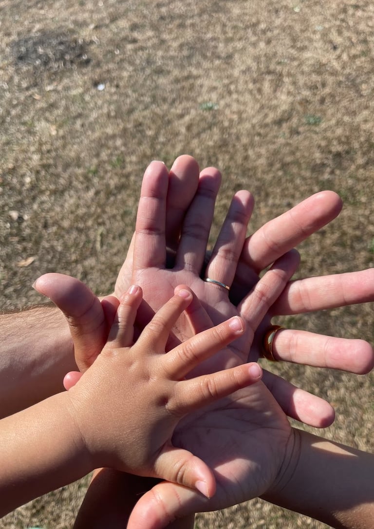 A family holding hands together