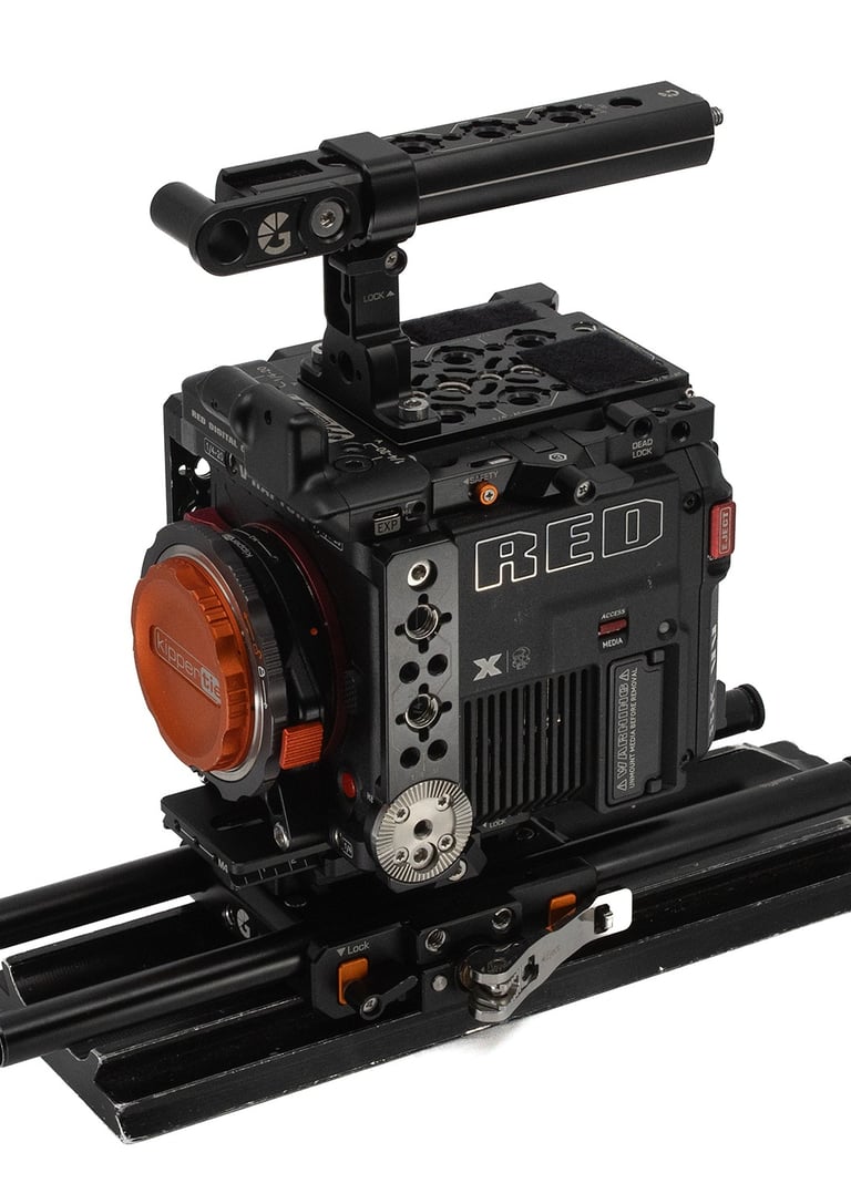 Professional RED V-Raptor digital cinema camera rig with top handle and baseplate on a white background.