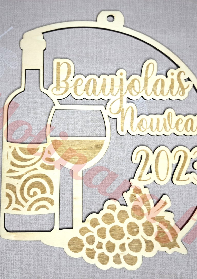 a wooden plaque with a wine glass and a bottle of wine