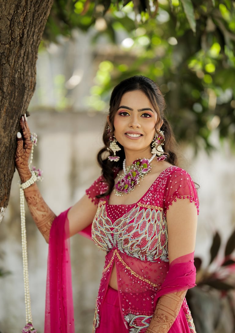 Closeup of bridal makeup in Vadodara with flawless skin, soft glam look and floral accessories for h
