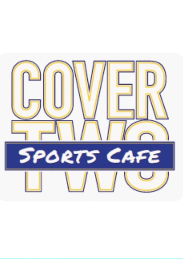 Logo for Cover Two Sports Cafe with bold yellow outlined lettering on a white background.