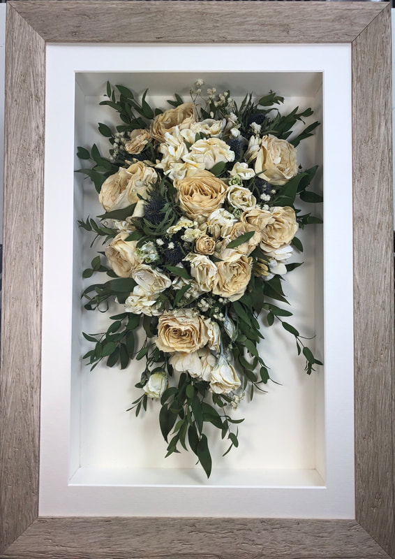 winter white trailing view preserved wedding bouquet in a frame