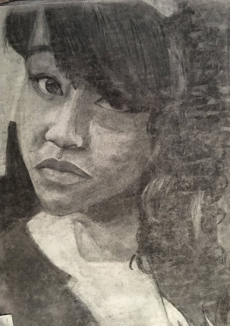 charcoal self portrait. black girl artist