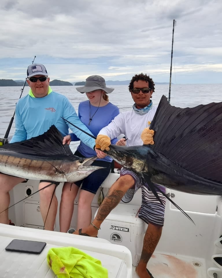 Happy guests with marlin catch during sport fishing charter in Papagayo, Costa Rica