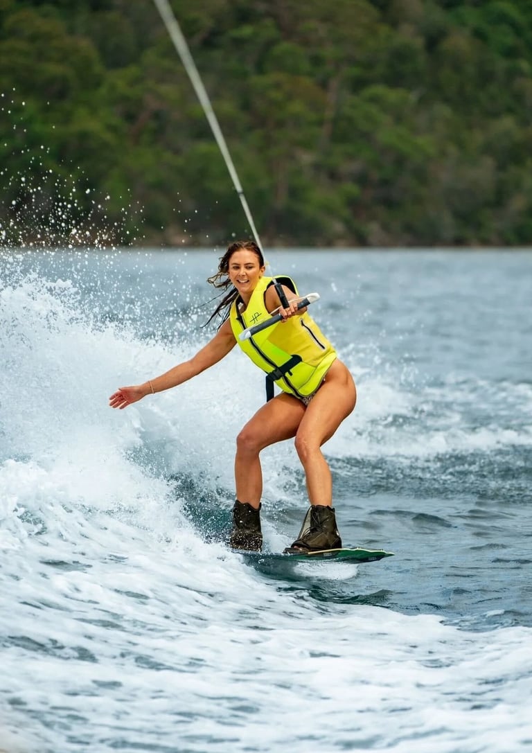 Wakeboarding at sunset during luxury catamaran tour in Papagayo Gulf