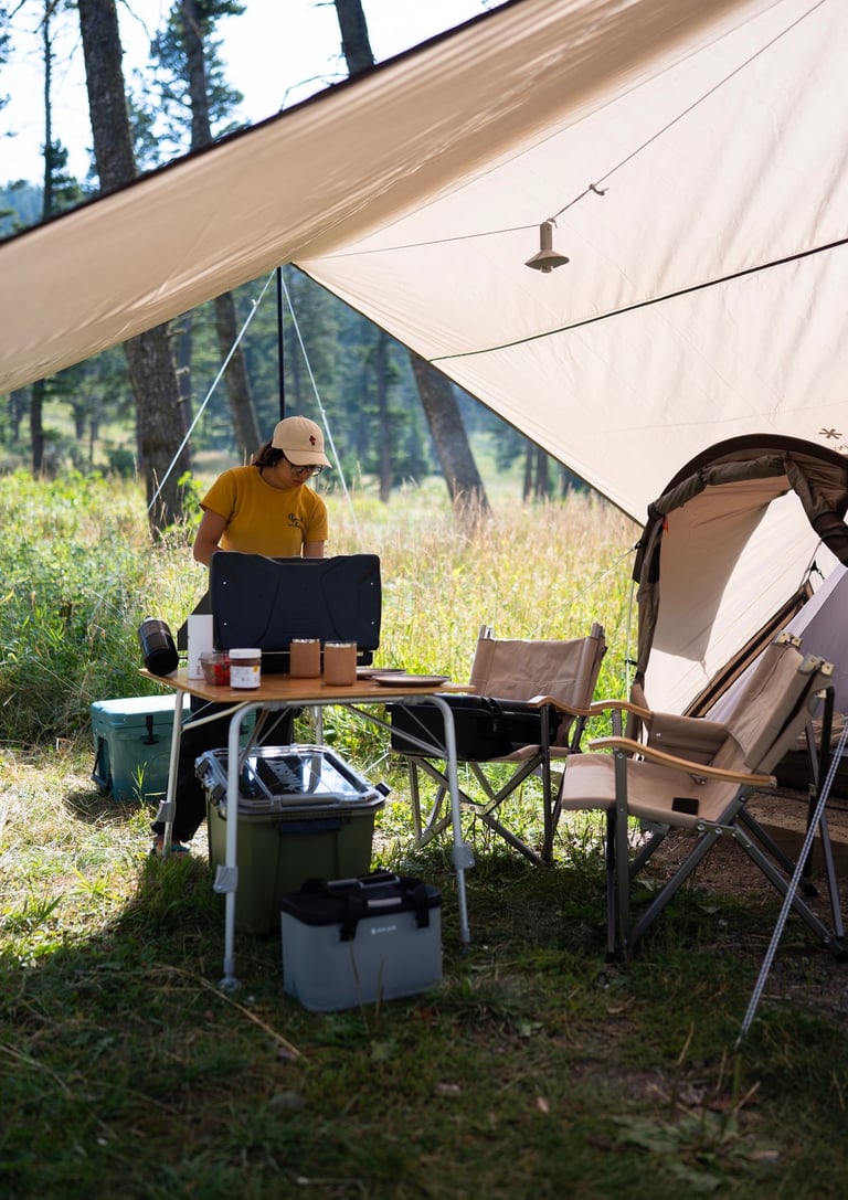 A woman cooking while camping