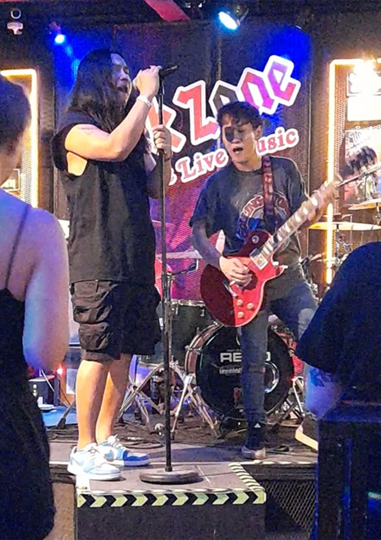 Singer and guitarist on stage at Rock Zone Bar near Soi 94, Hua Hin