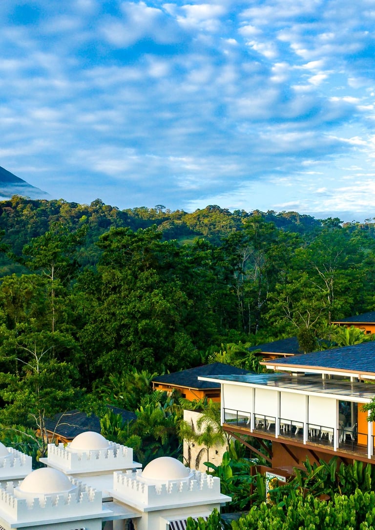 Luxury resort nestled in a lush Costa Rican rainforest with a view of the Arenal Volcano.