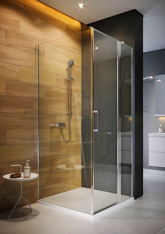 Kabina prysznicowa w nowoczesnym stylu. Połączenie szkła i metalu oraz kamienia