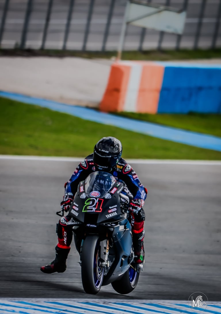 a person riding a motorcycle on a track