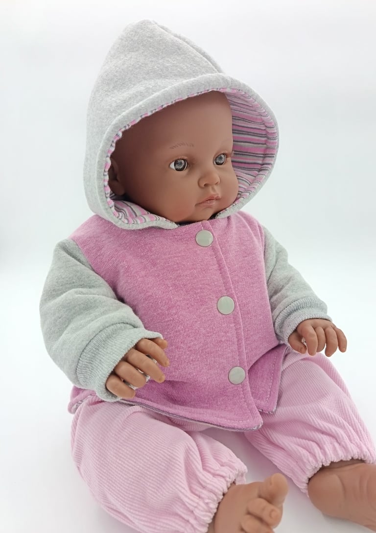 Minikane toddler doll wearing jacket made for Baby Born